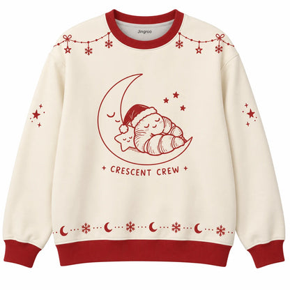 Crescent Crew Ugly Christmas Sweater - Christmas Jumper (front): sleepy croissant reclines on crescent moon